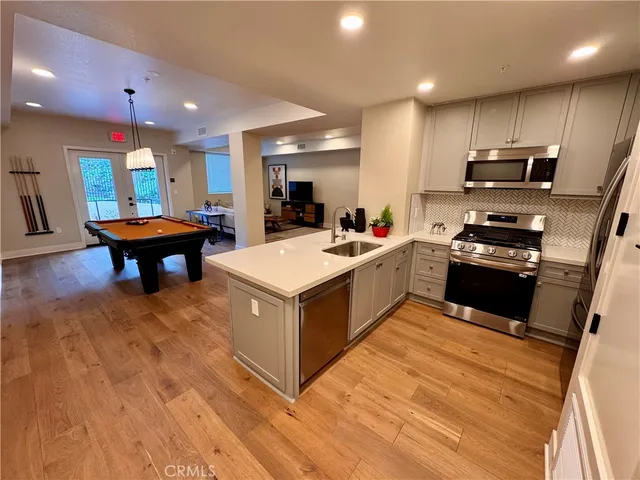 a outdoor living space with patio furniture and a fireplace