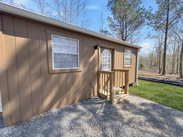 a view of backyard with deck and backyard