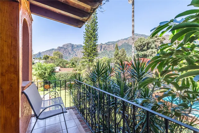 a view of a balcony with chairs