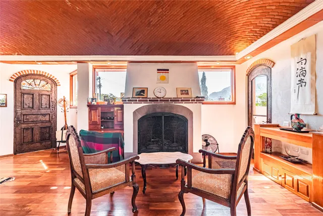 a view of a chairs and fire pit in the patio