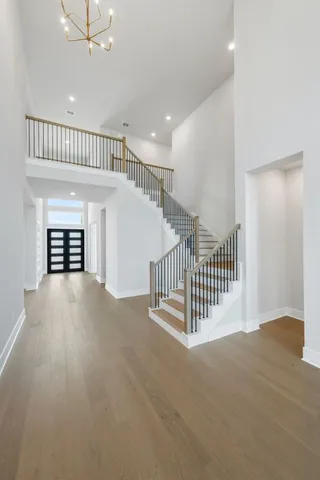 en view interior of a house with stairs and a floor to ceiling window