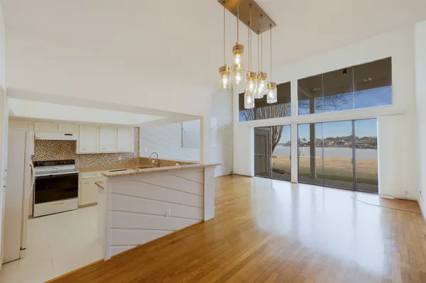 a kitchen with a sink stove and microwave