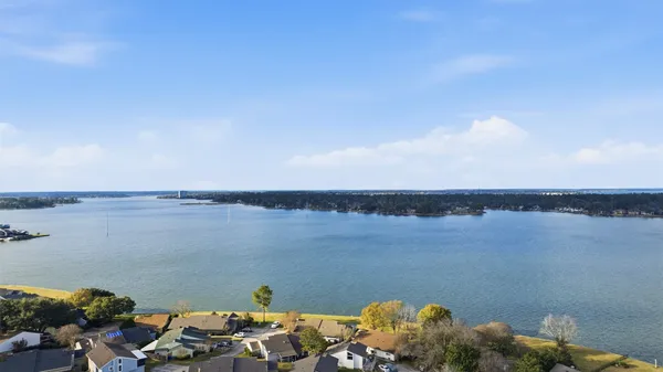 an aerial view of a house with a ocean view