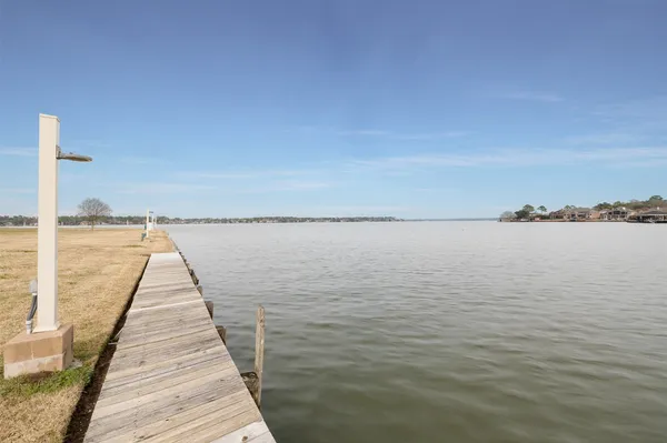 a view of a swimming pool with a yard