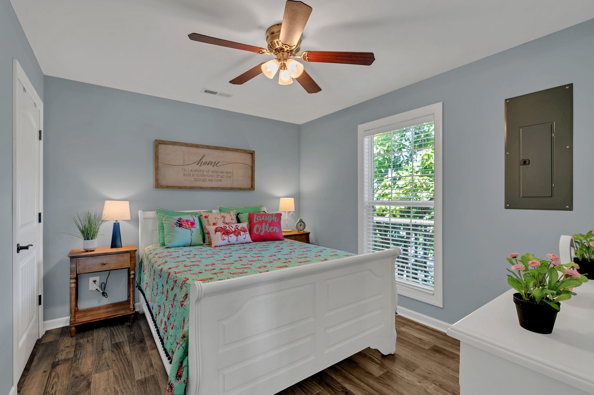 219 Tn River Estates Road Clifton, TN 38425 - Photo 17 of 38 a bedroom with a bed and a chandelier