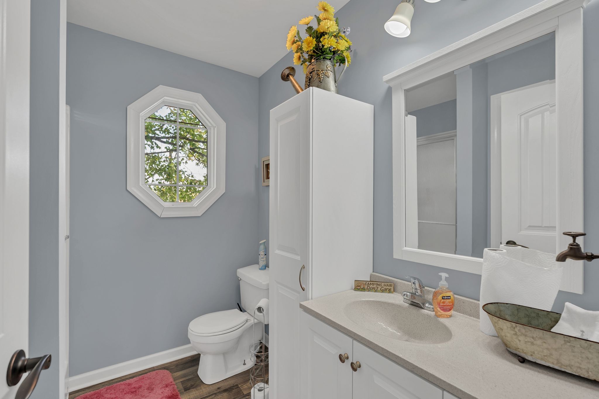 219 Tn River Estates Road Clifton, TN 38425 - Photo 20 of 38 a bathroom with a toilet sink and mirror