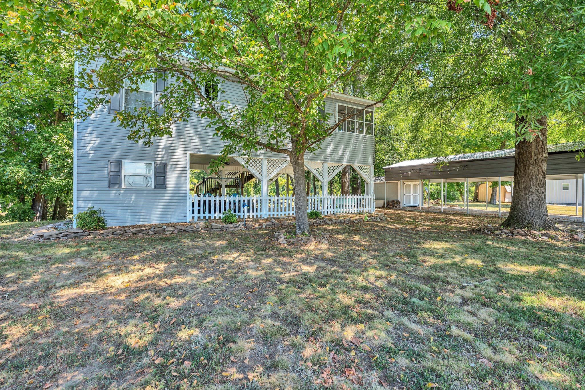219 Tn River Estates Road Clifton, TN 38425 - Photo 26 of 38 front view of a house with a tree