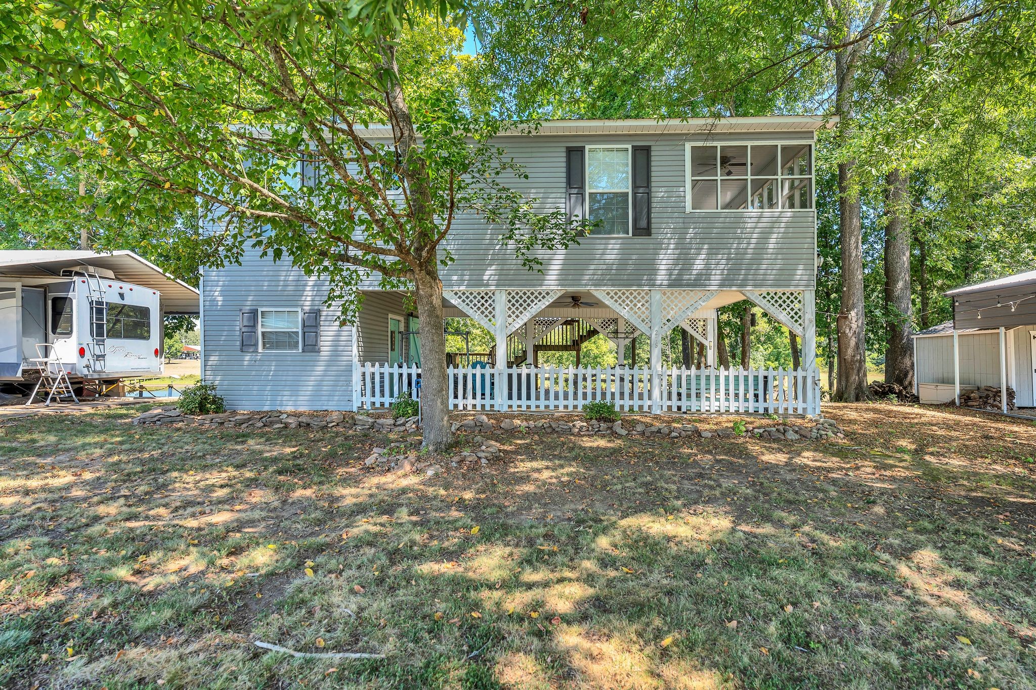 219 Tn River Estates Road Clifton, TN 38425 - Photo 28 of 38 a view of a house with a yard and a garden
