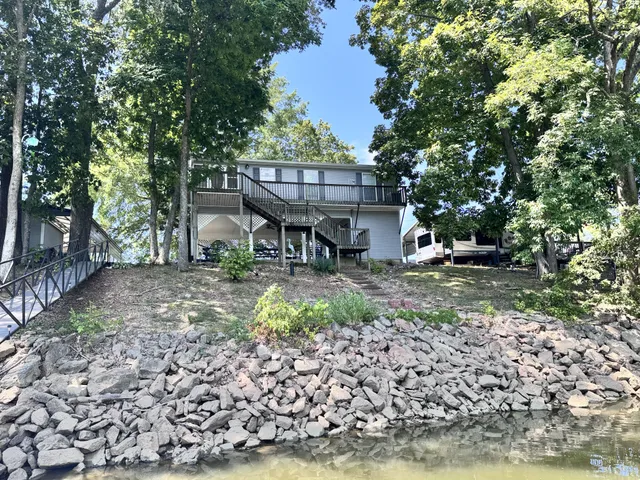 a view of a wooden bench sitting in a park