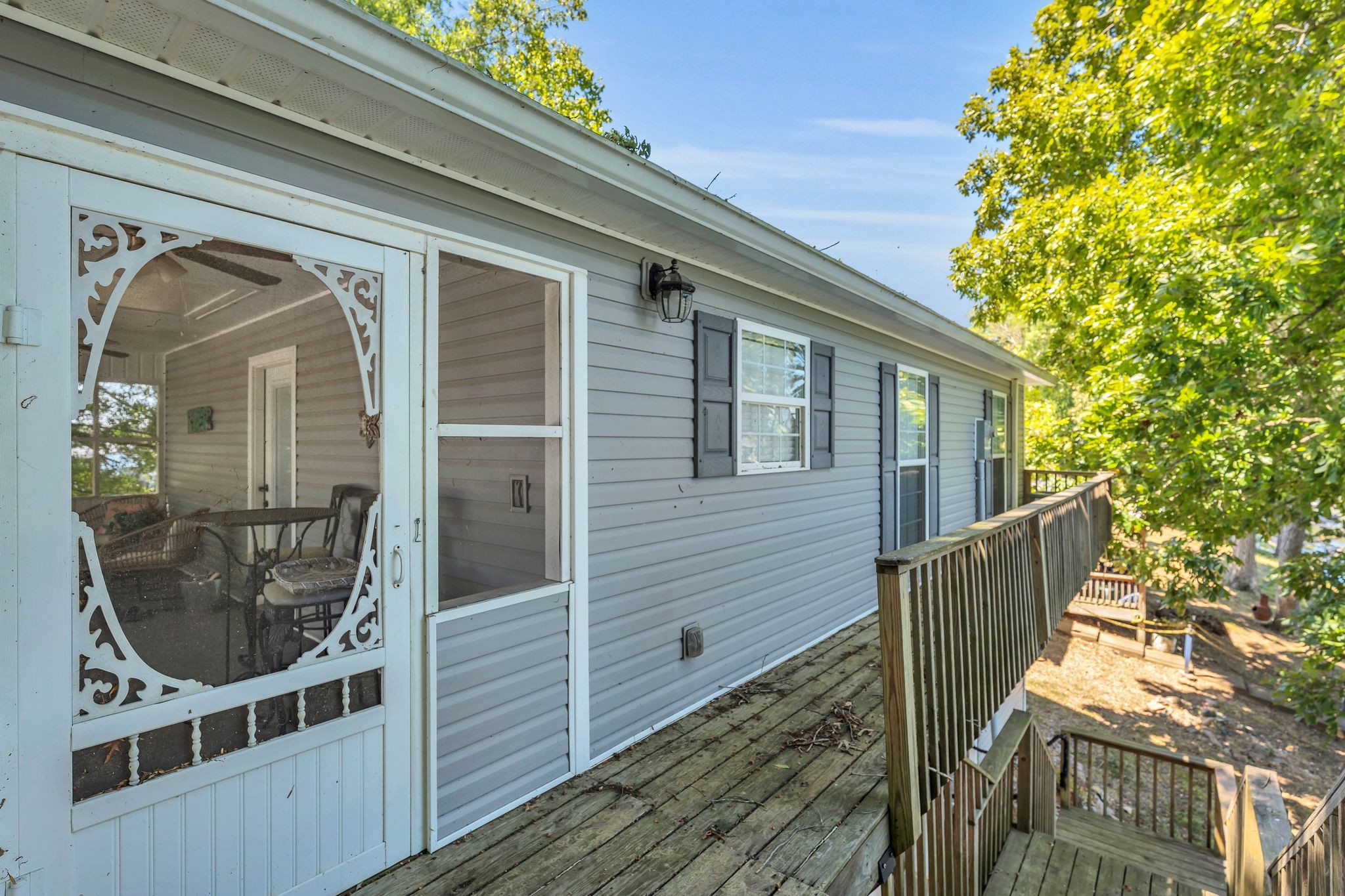 219 Tn River Estates Road Clifton, TN 38425 - Photo 35 of 38 a view of a balcony with wooden floor and fence and a porch