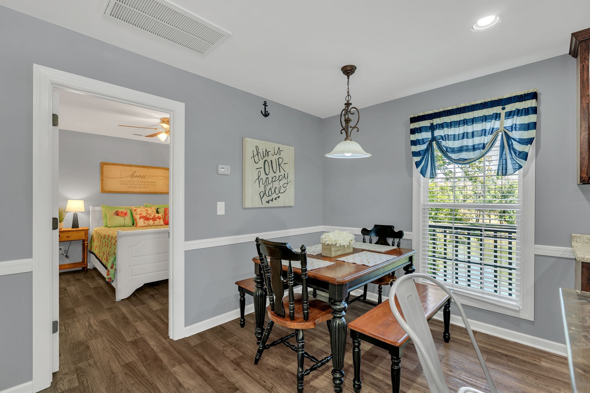 219 Tn River Estates Road Clifton, TN 38425 - Photo 10 of 38 a view of a dining room with furniture window and wooden floor