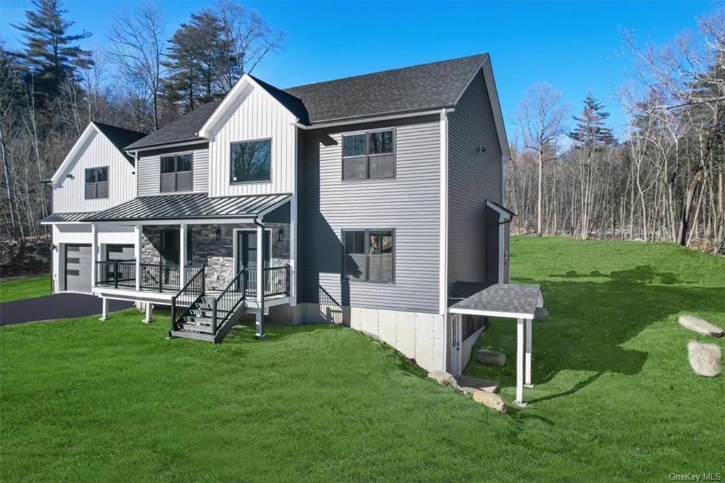 346 Shawanga Lodge Road Bloomingburg, NY 12721 - Photo 2 of 36 front view of house featuring a lawn and covered porch