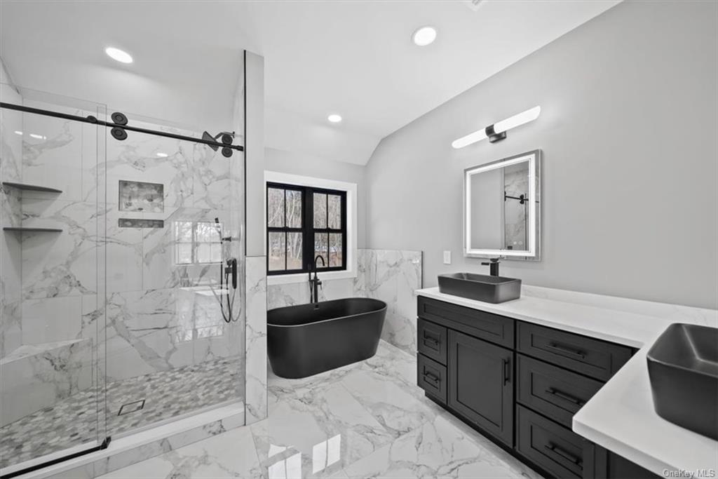 346 Shawanga Lodge Road Bloomingburg, NY 12721 - Photo 21 of 36 Bathroom with independent shower and bath and vanity