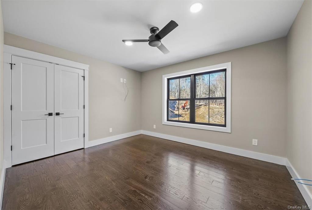 346 Shawanga Lodge Road Bloomingburg, NY 12721 - Photo 25 of 36 Unfurnished bedroom with a closet, ceiling fan, and dark hardwood / wood-style floors