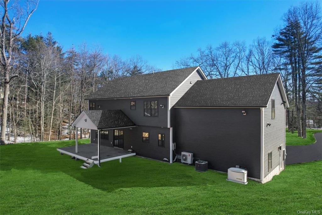 346 Shawanga Lodge Road Bloomingburg, NY 12721 - Photo 33 of 36 Rear view of house featuring a patio area and a yard
