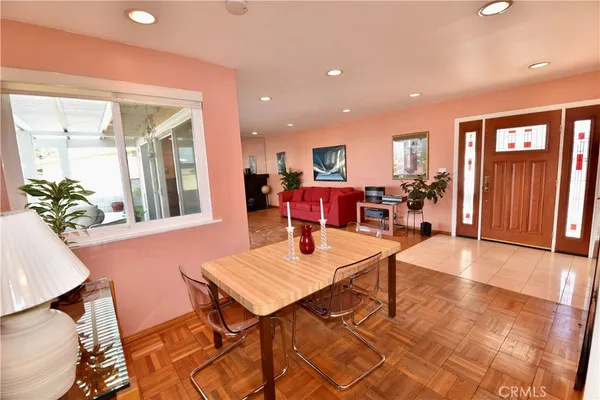 a living room with furniture a window and a table