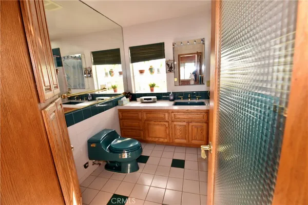a kitchen with stainless steel appliances granite countertop a sink and a stove