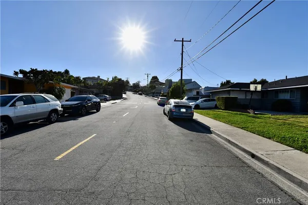 a view of a city street with cars