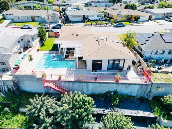 an aerial view of a house with swimming pool