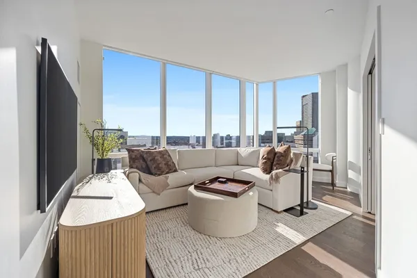 a living room with furniture and a window
