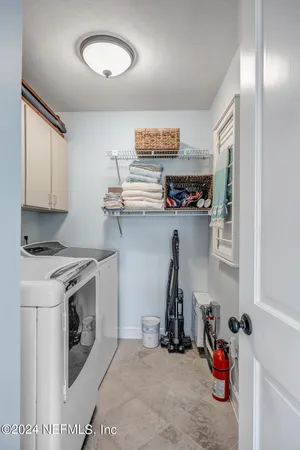 a kitchen with storage and utility