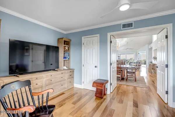 a living room with furniture fireplace and flat screen tv