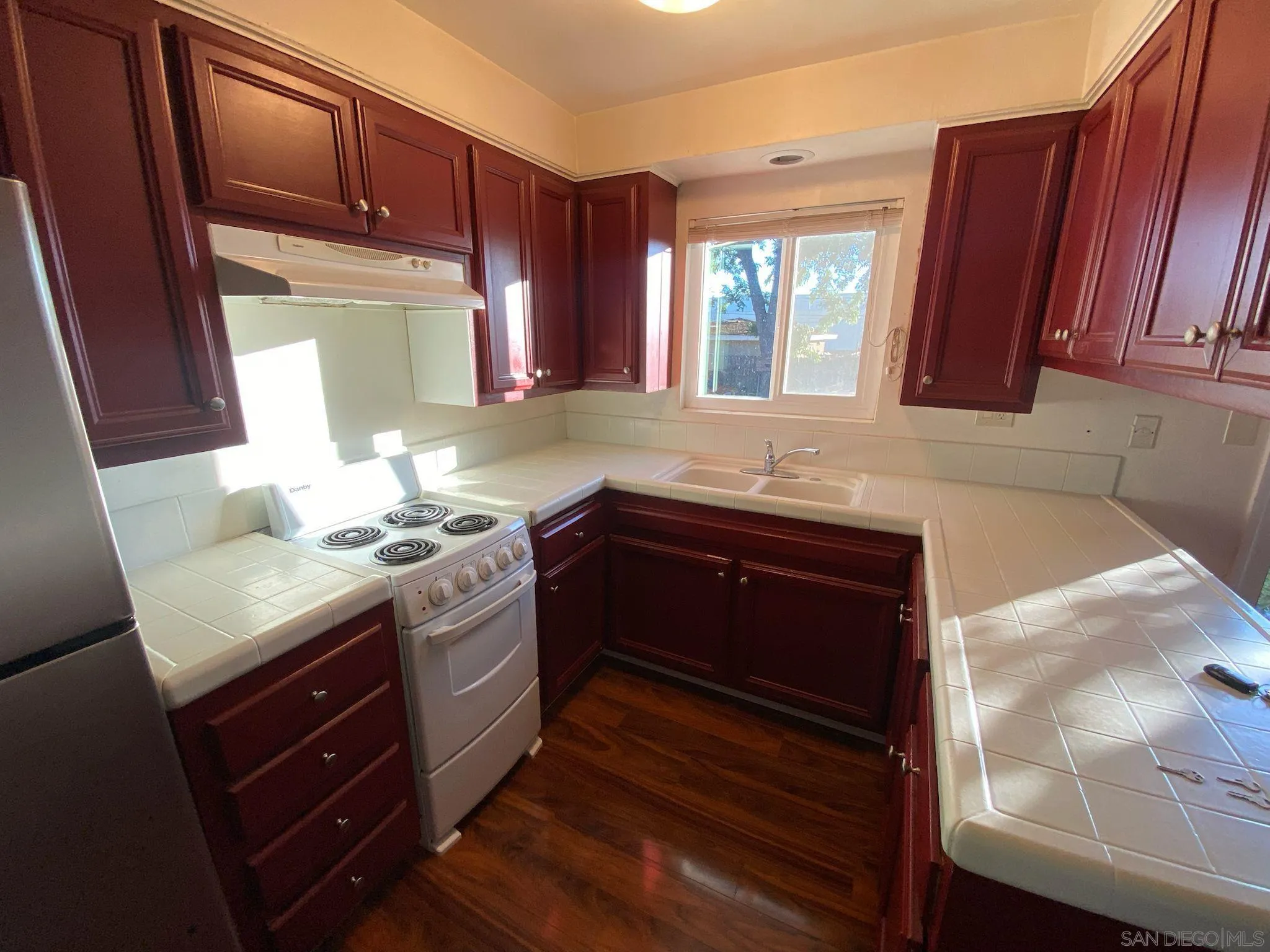253 North Cedar Street Escondido, CA 92025 - Photo 11 of 18 a kitchen with a sink and a window