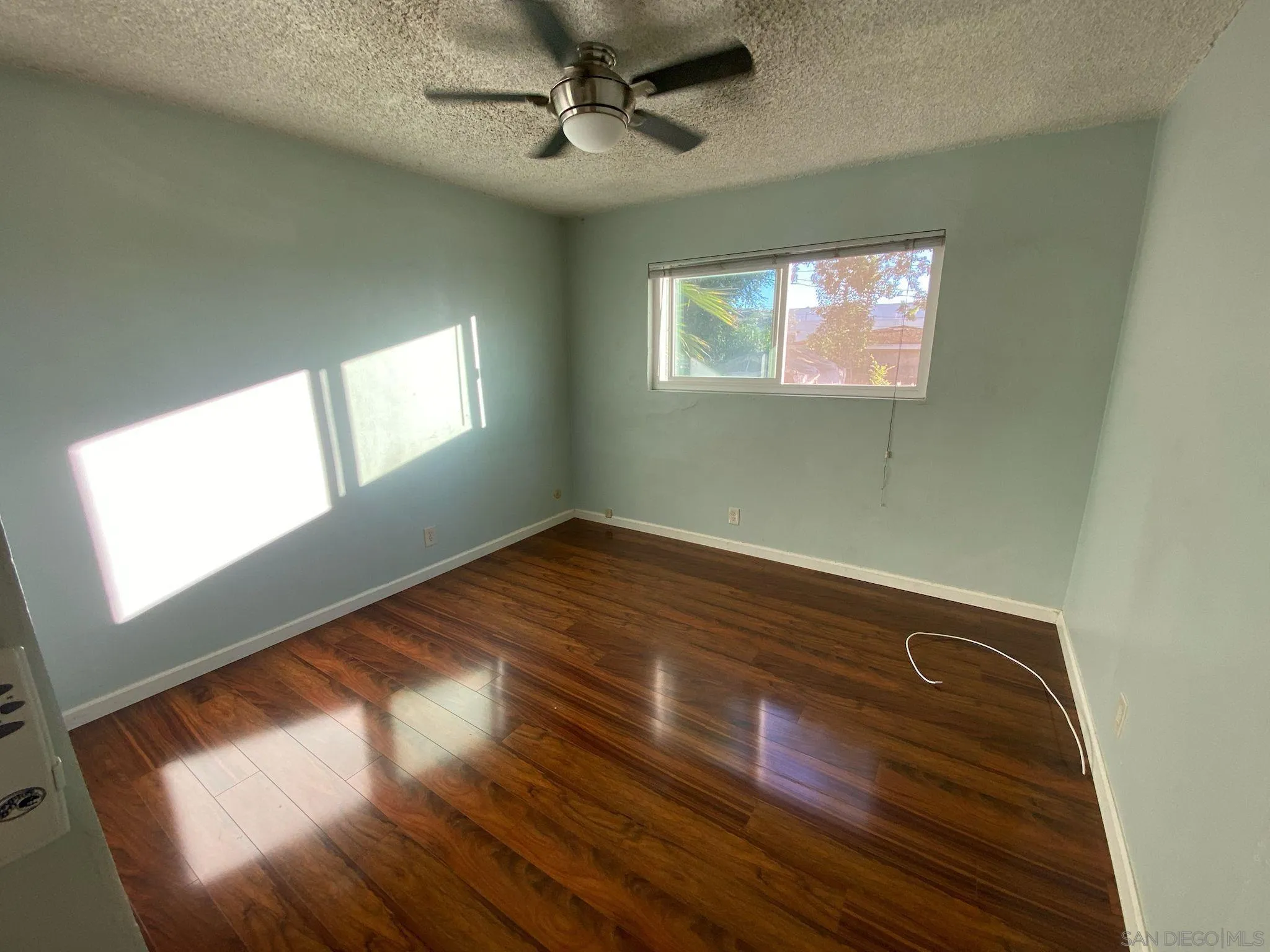 253 North Cedar Street Escondido, CA 92025 - Photo 15 of 18 a view of empty room with windows