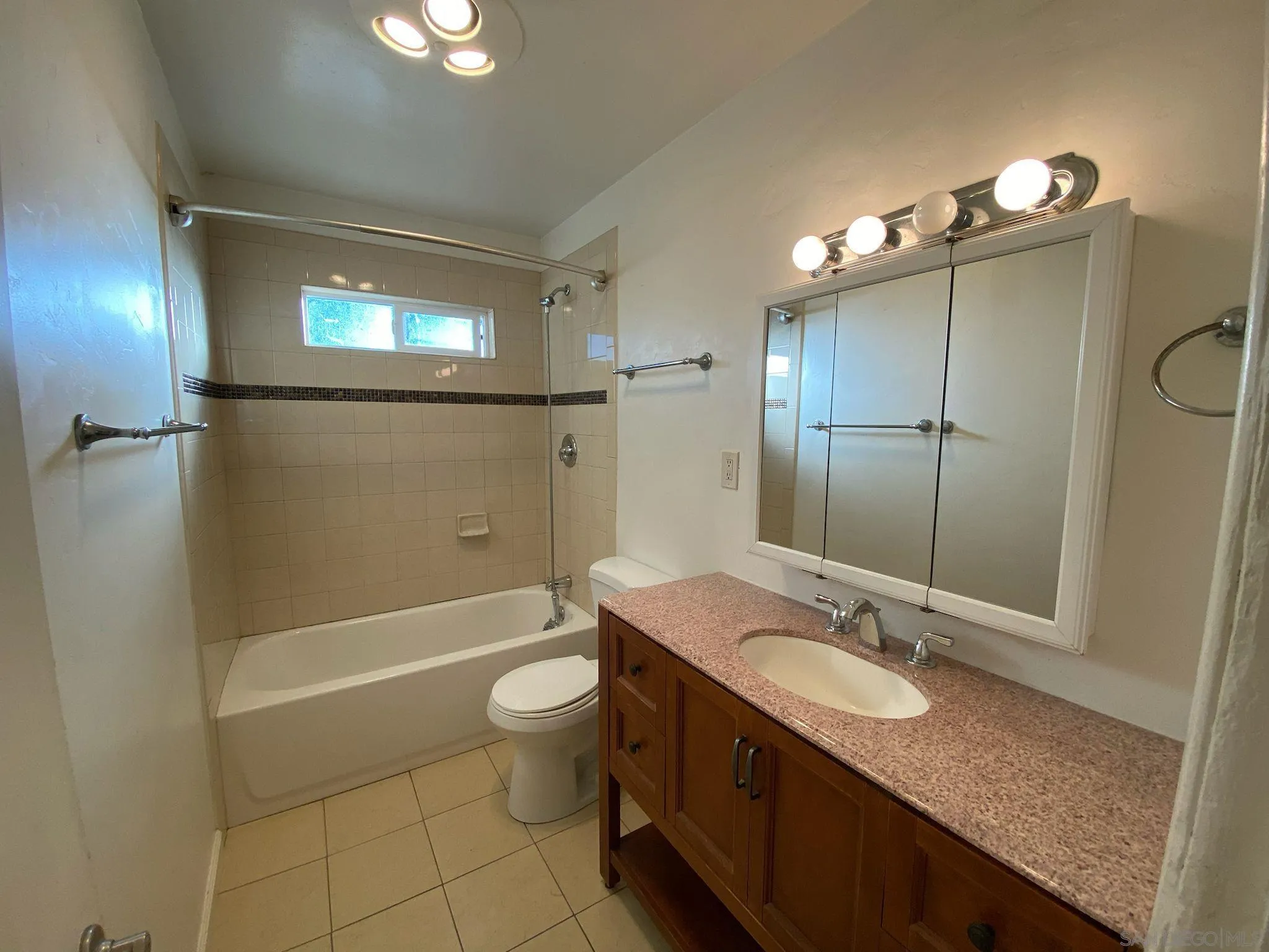 253 North Cedar Street Escondido, CA 92025 - Photo 18 of 18 a bathroom with a granite countertop sink toilet and shower