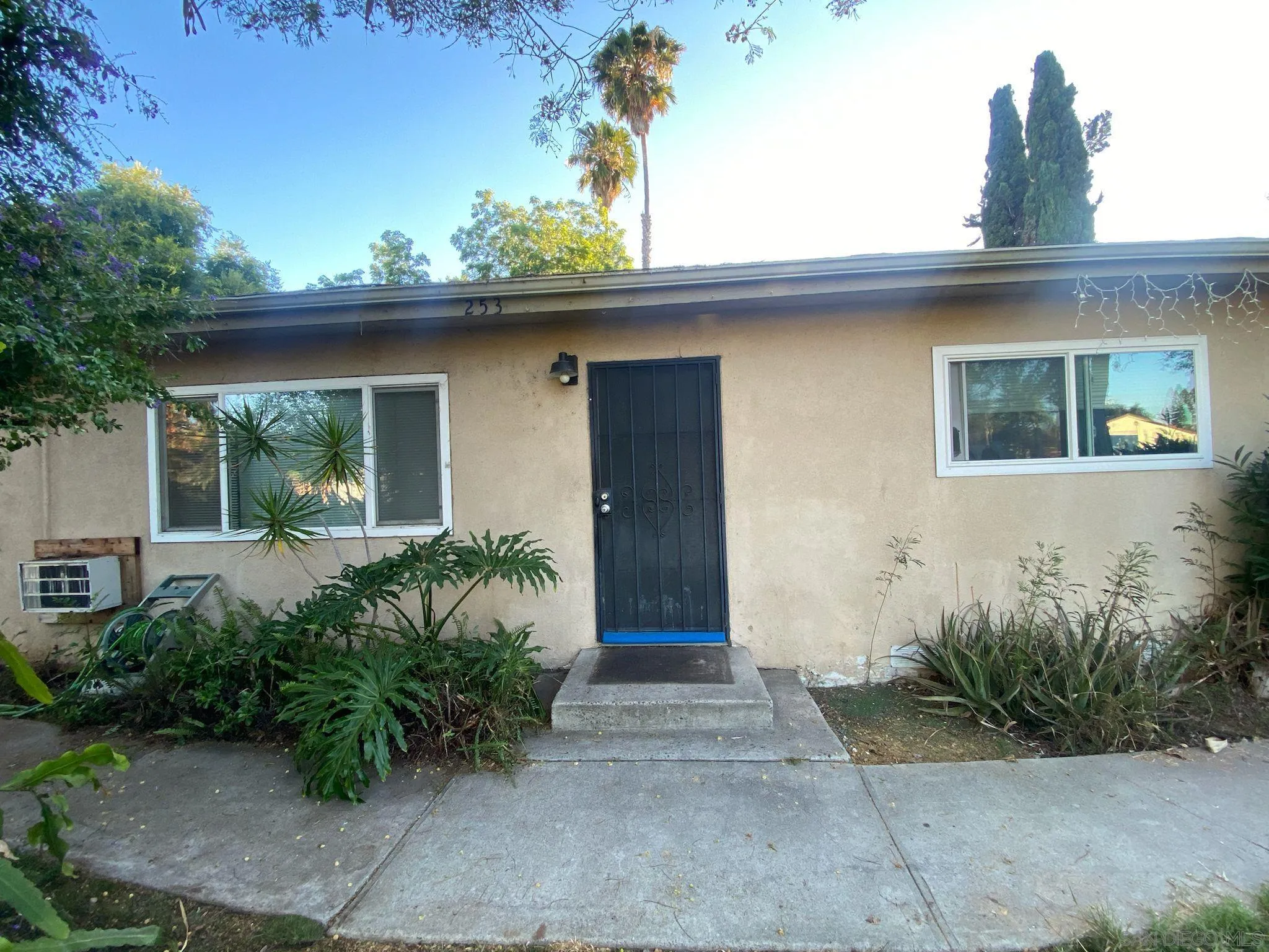 253 North Cedar Street Escondido, CA 92025 - Photo 2 of 18 a front view of a house with garden