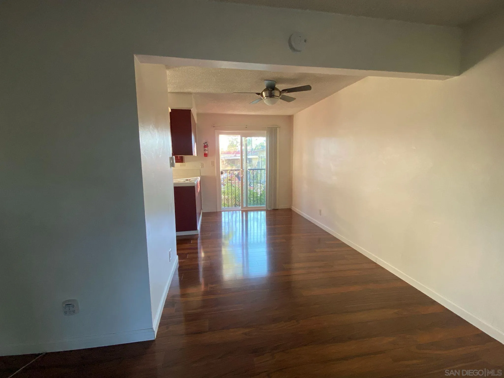 253 North Cedar Street Escondido, CA 92025 - Photo 6 of 18 a view of a hallway view with wooden floor and staircase