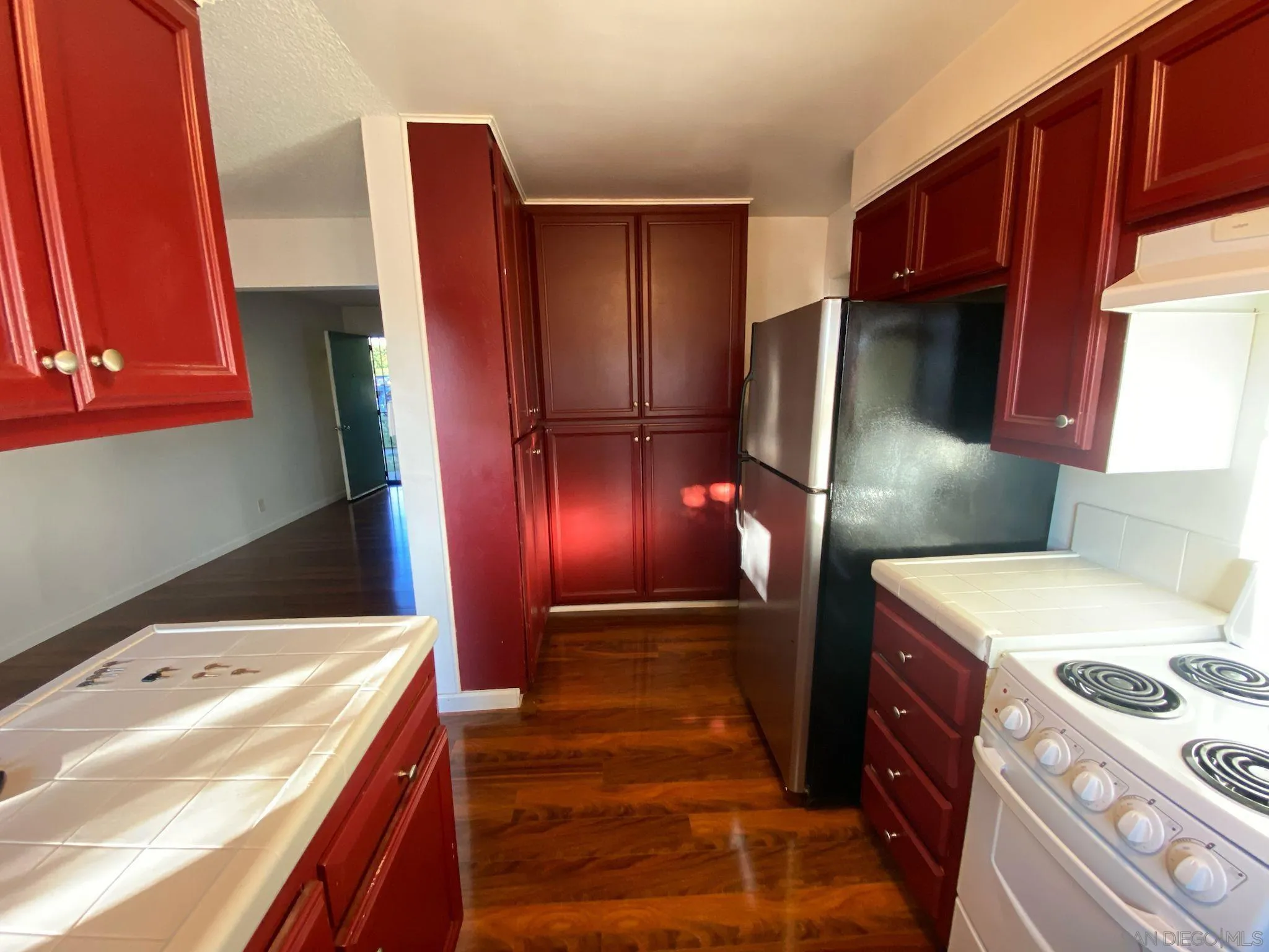253 North Cedar Street Escondido, CA 92025 - Photo 9 of 18 a kitchen that has a sink and a refrigerator
