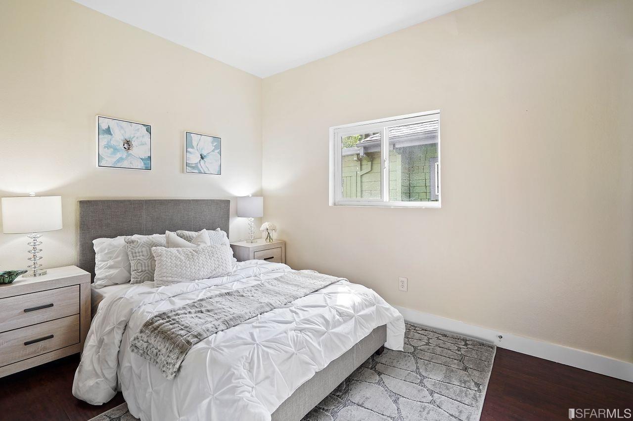 3036 14th Avenue Oakland, CA 94602 - Photo 13 of 35 a bedroom with a bed and a window