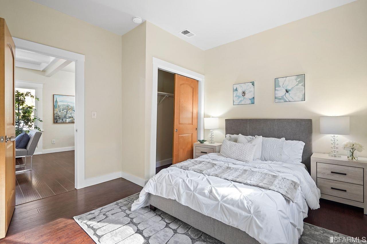 3036 14th Avenue Oakland, CA 94602 - Photo 14 of 35 a bedroom with a bed and wooden floor