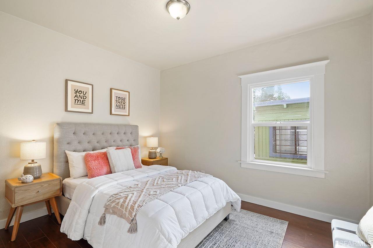 3036 14th Avenue Oakland, CA 94602 - Photo 16 of 35 a bedroom with a bed and window