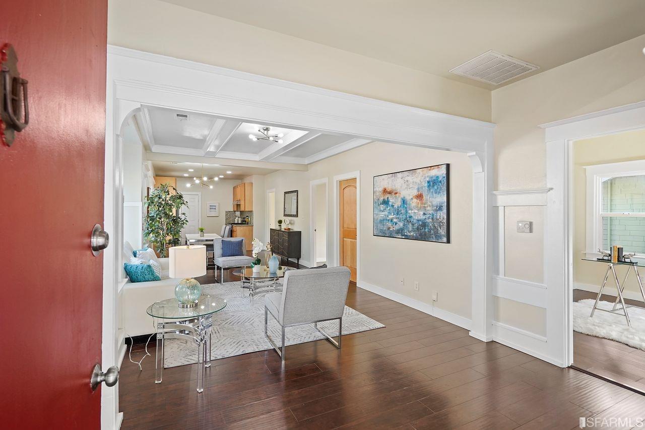 3036 14th Avenue Oakland, CA 94602 - Photo 3 of 35 a living room with furniture wooden floor and a large window