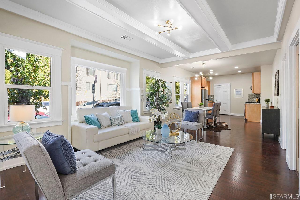 3036 14th Avenue Oakland, CA 94602 - Photo 4 of 35 a living room with furniture wooden floor and a large window