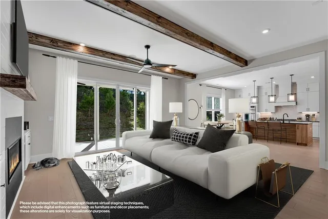 a view of an empty room with a fireplace and a window