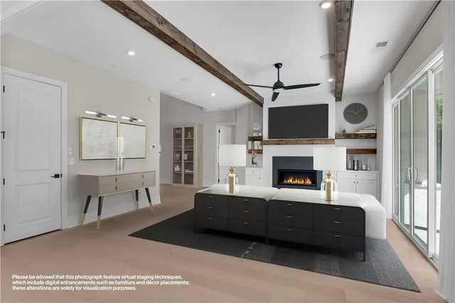 a kitchen with stainless steel appliances granite countertop a stove a sink a dining table and chairs with wooden floor