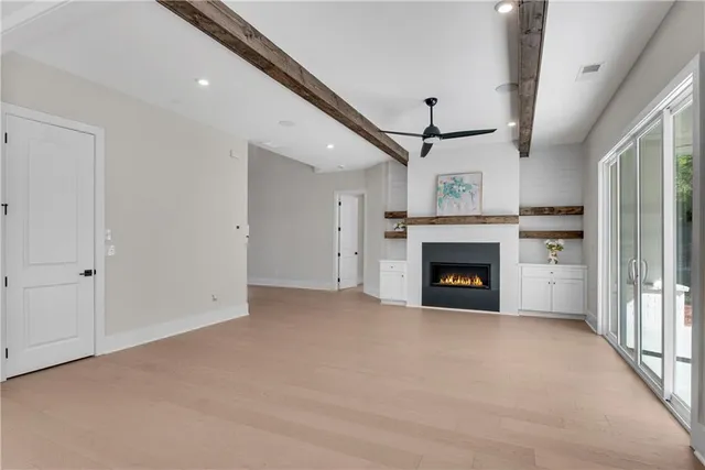 a large kitchen with stainless steel appliances kitchen island granite countertop a lot of counter space and a sink