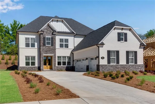 a front view of a house with a yard