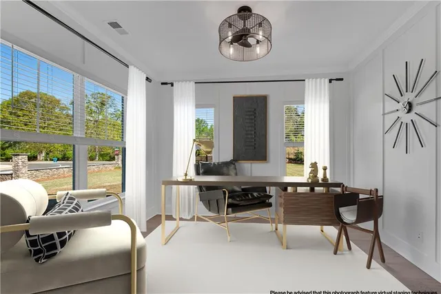 an empty room with windows and entrance