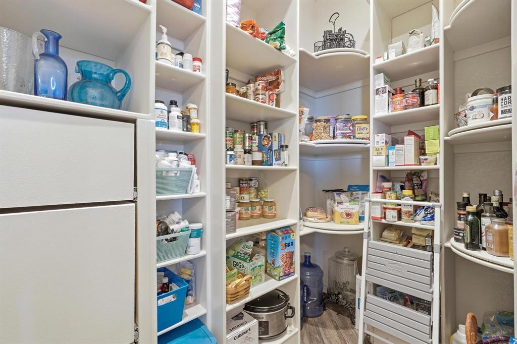 249 Rising Star Drive Abilene, TX 79606 - Photo 11 of 40 a room with a refrigerator and a shelf