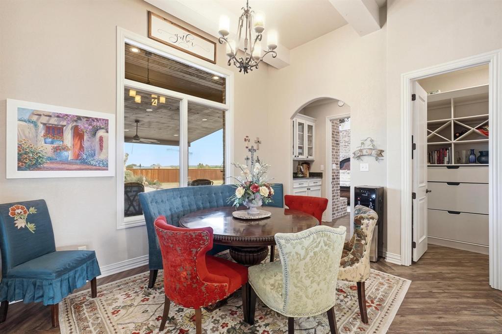 249 Rising Star Drive Abilene, TX 79606 - Photo 13 of 40 a dining room with furniture a chandelier and wooden floor