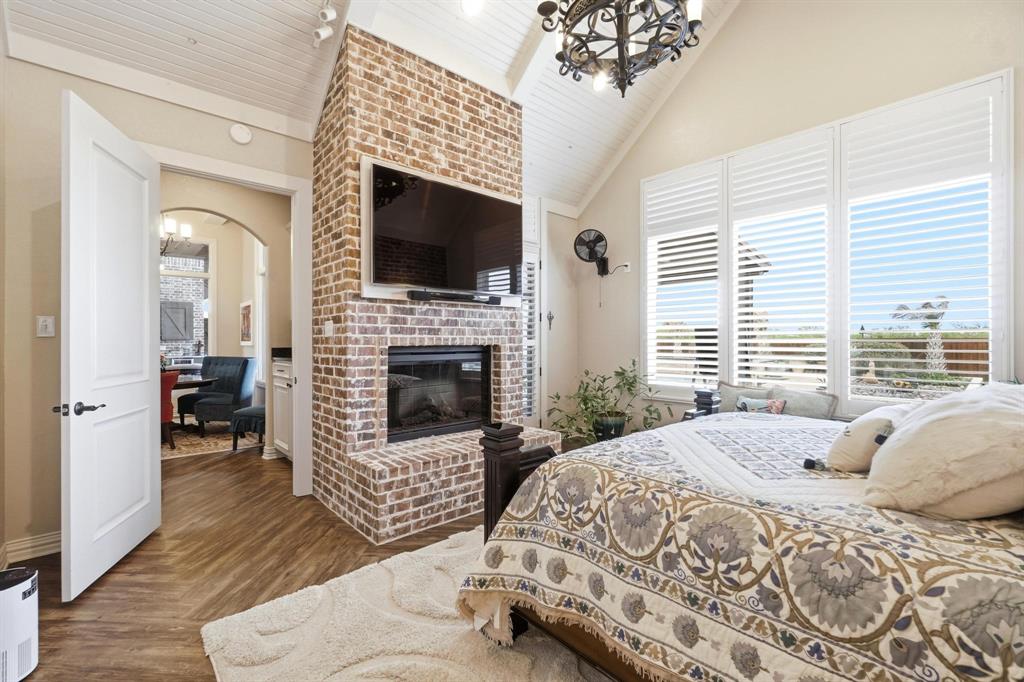 249 Rising Star Drive Abilene, TX 79606 - Photo 16 of 40 a bedroom with a bed and a fireplace