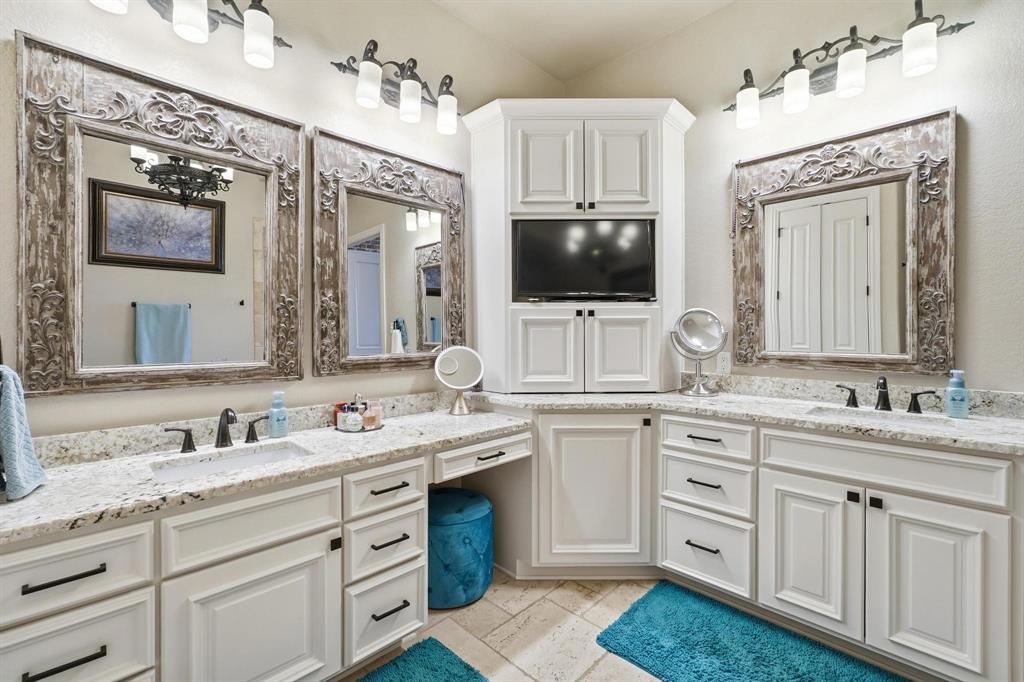 249 Rising Star Drive Abilene, TX 79606 - Photo 17 of 40 a bathroom with a sink vanity and mirror