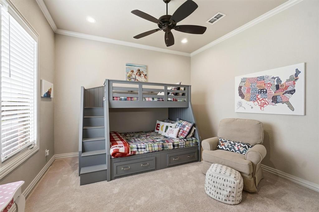 249 Rising Star Drive Abilene, TX 79606 - Photo 20 of 40 a bedroom with a bed and a chandelier