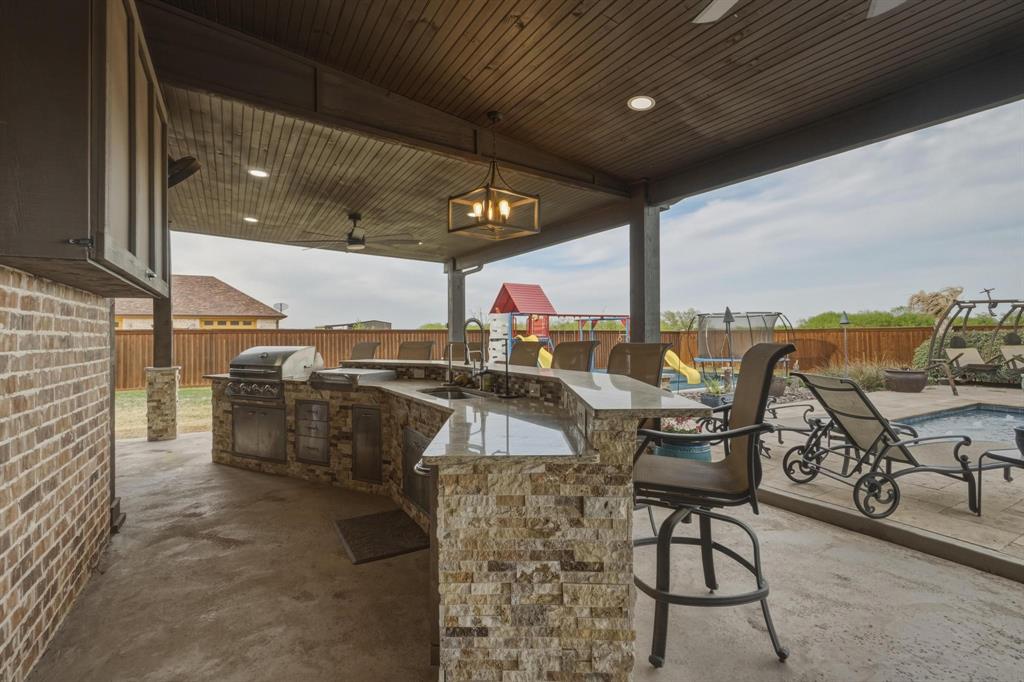 249 Rising Star Drive Abilene, TX 79606 - Photo 35 of 40 a dining room with furniture and a floor to ceiling window