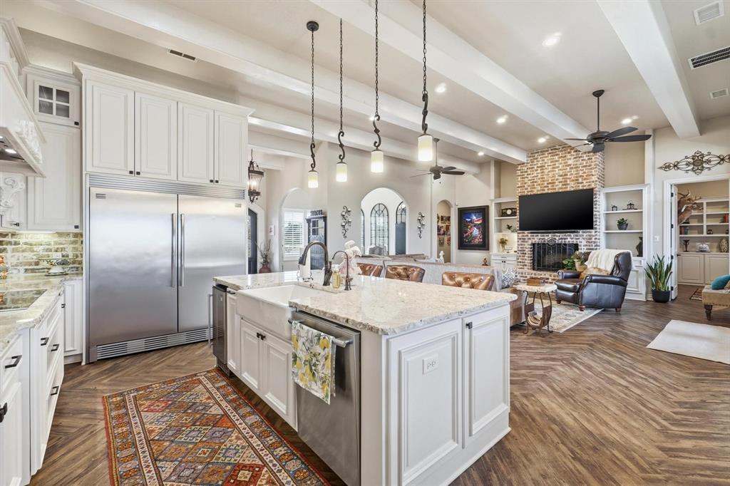 249 Rising Star Drive Abilene, TX 79606 - Photo 10 of 40 a large kitchen with kitchen island a large island in it