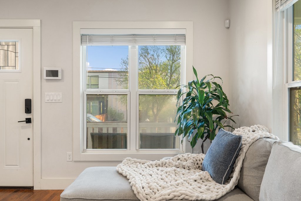 2702 Crest Avenue, Unit 1 Austin, TX 78702 - Photo 8 of 29 Large wood-framed windows bring in abundant natural light while adding timeless character.